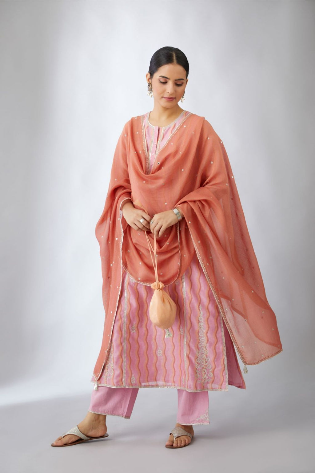 Pink and peach hand block printed silk chanderi kurta set with silver zari and gota embroidery.