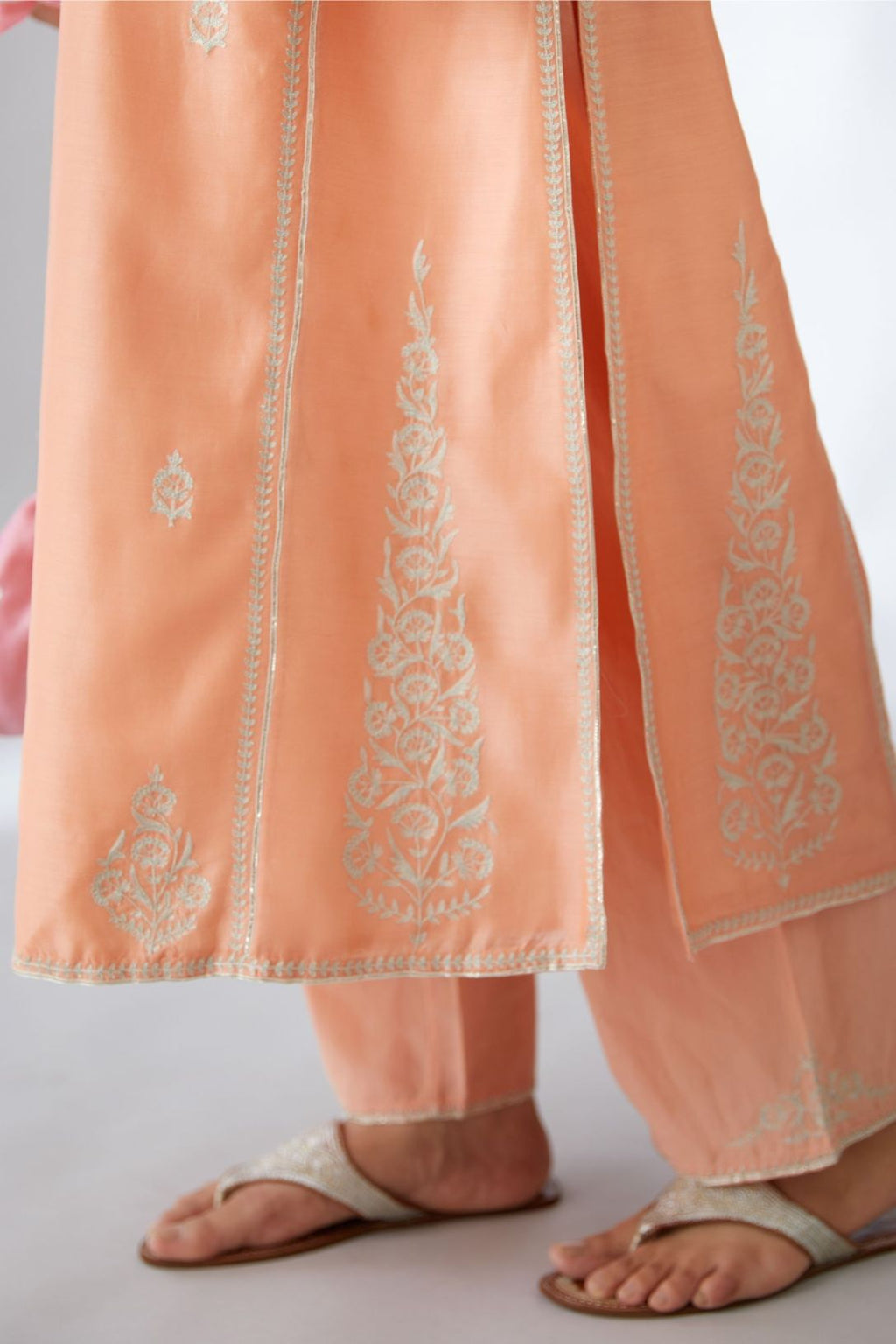 Peach silk chanderi kurta set with all-over silver zari & gota embroidery.
