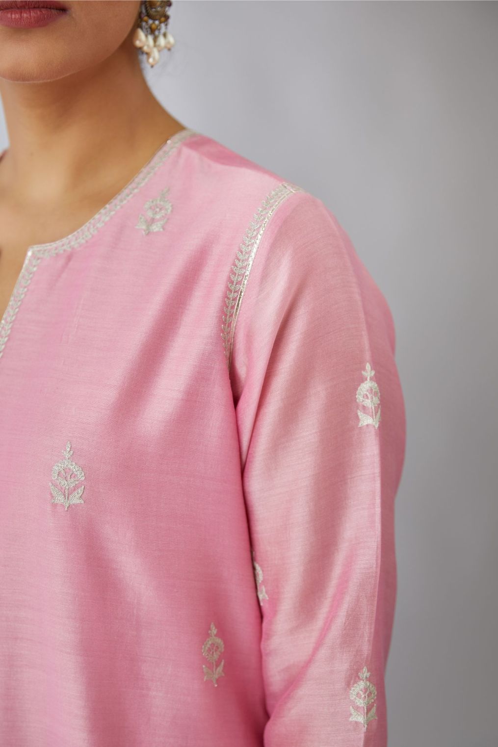 Pink silk chanderi kurta set with all-over silver zari embroidery.