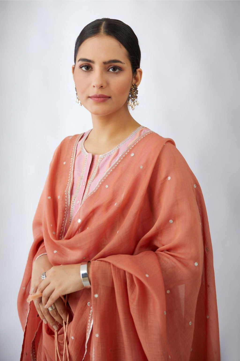 Rust cotton chanderi dupatta with silver zari embroidery at edges, highlighted with all-over hand attached mirrors (Dupatta)