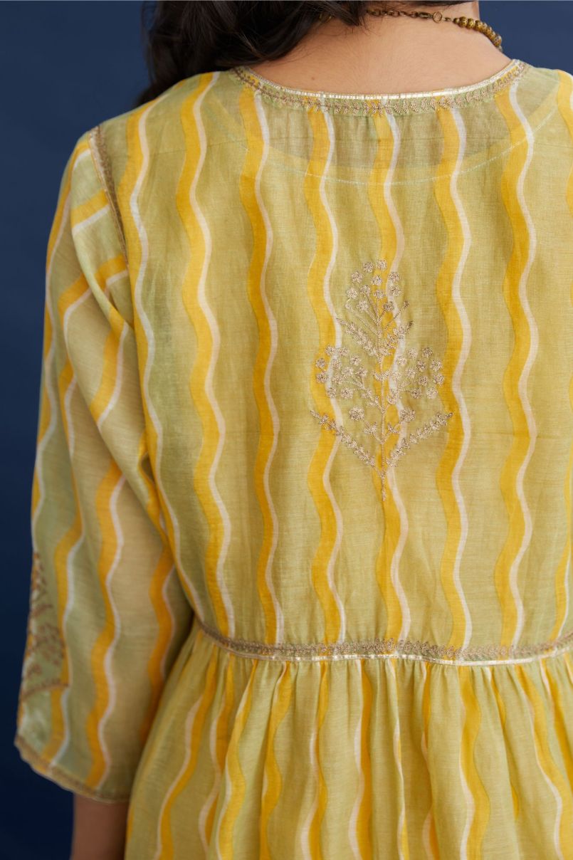 Cotton Chanderi kurta set with all-over hand block print, highlighted with dull gold zari embroidery.