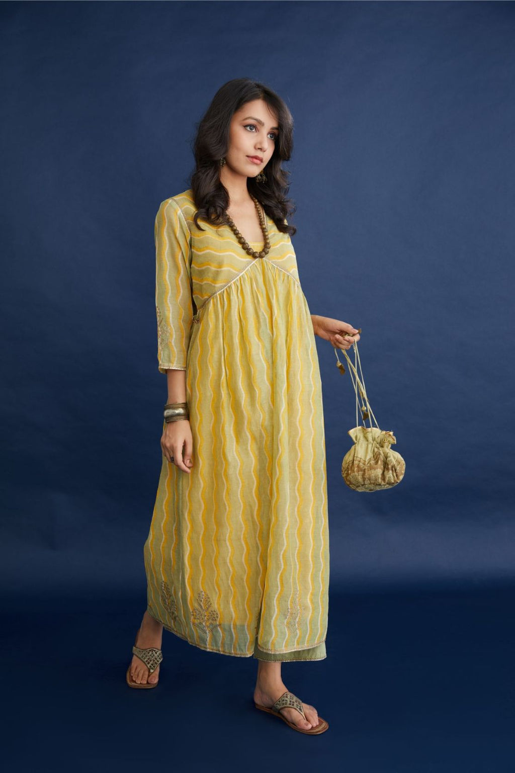 Cotton Chanderi kurta set with all-over hand block print, highlighted with dull gold zari embroidery.