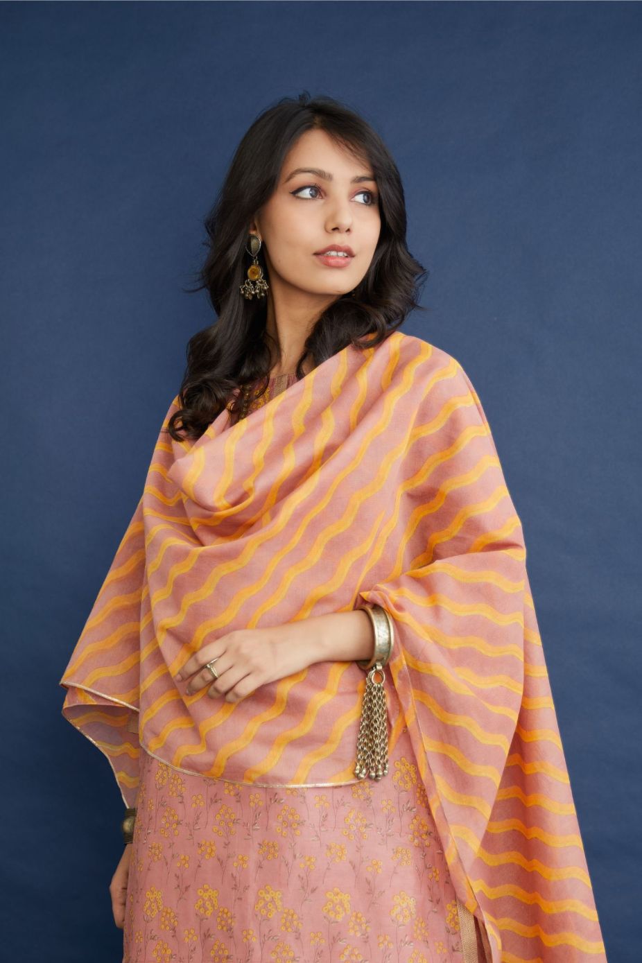Dusty rose and yellow hand block printed short kurta set, highlighted with dull gold quilting.