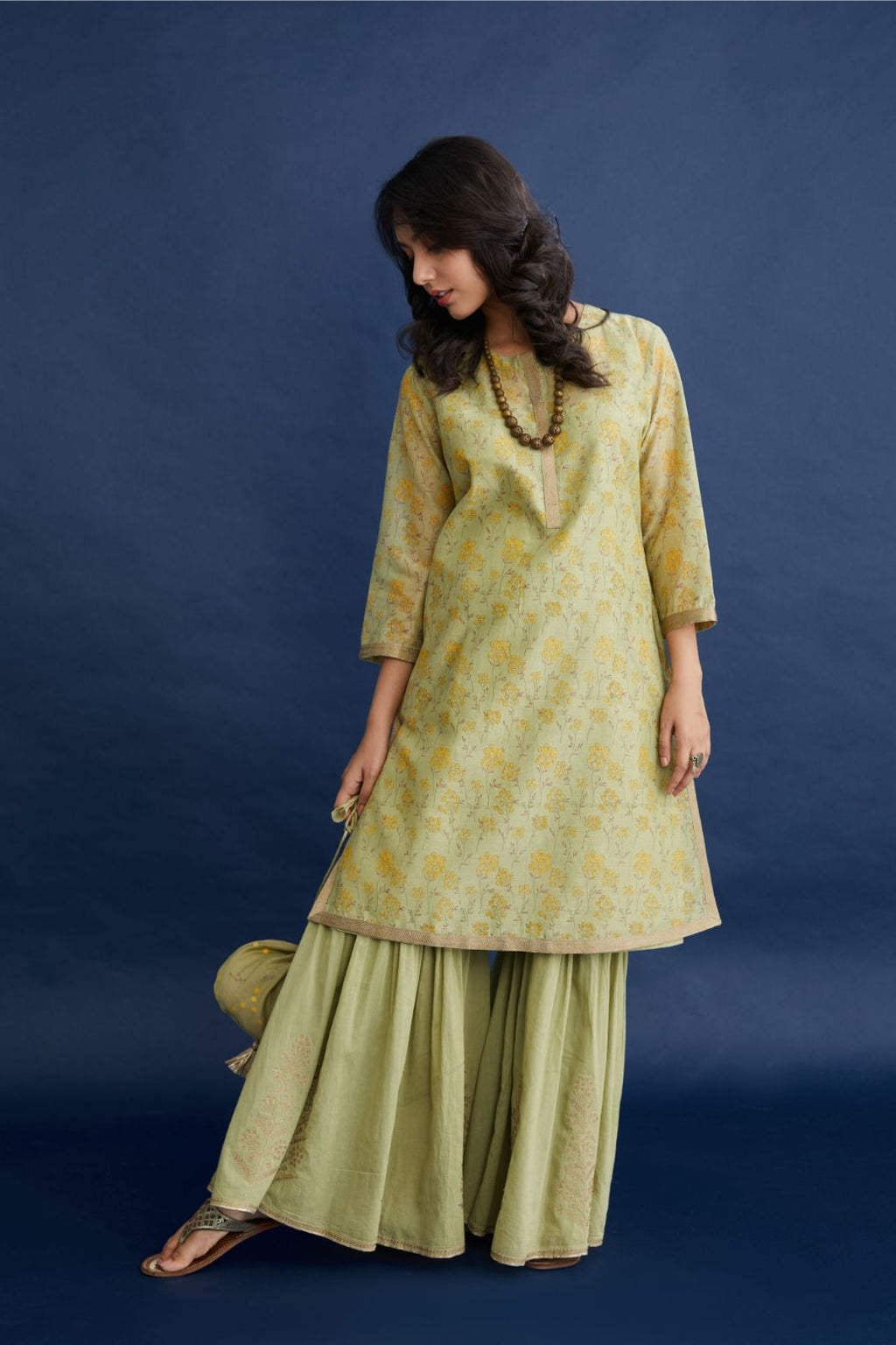 Green & yellow hand block printed short kurta set, highlighted with dull gold quilting.