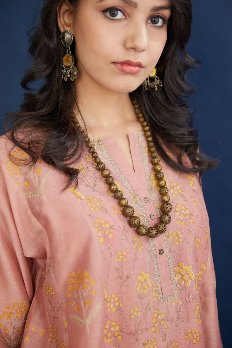 Hand block printed short kalidar kurta set, highlighted with delicate contrast coloured and dull gold zari embroidery.