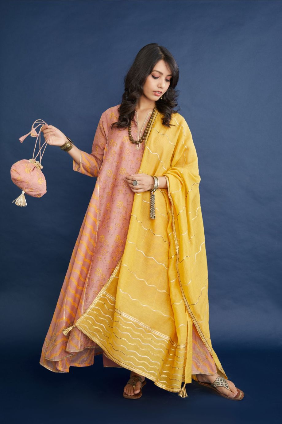Dusty rose and yellow hand block printed cotton chanderi kurta set with asymmetric hem.