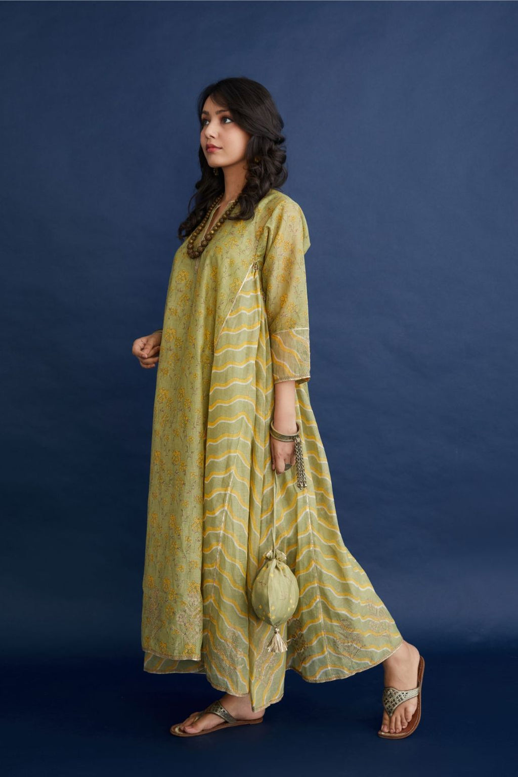 Green and yellow hand block printed cotton chanderi kurta set with asymmetric hem.