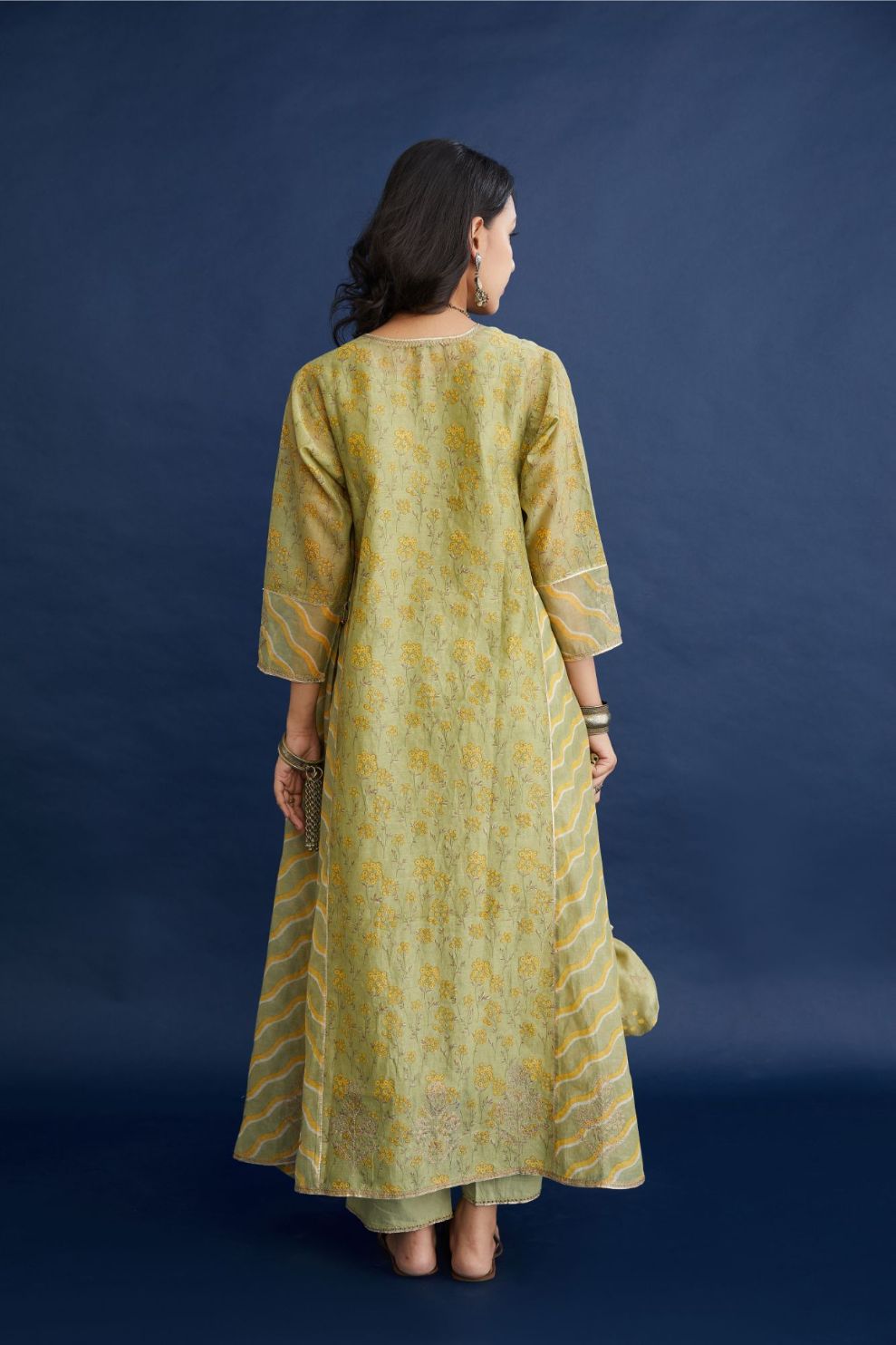 Green and yellow hand block printed cotton chanderi kurta set with asymmetric hem.