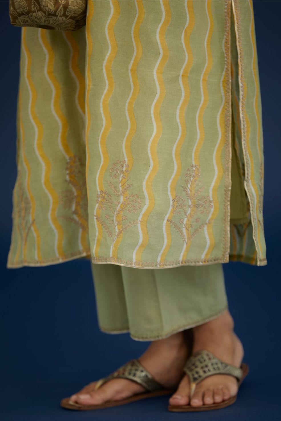 Green & yellow hand block printed straight kurta set, highlighted with dull gold zari embroidery.