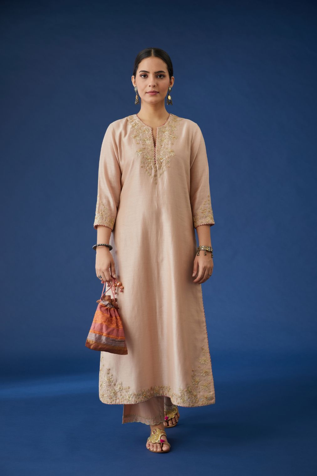 Dusty pink silk chanderi straight kurta set with gota embroidery at neck and hem, highlighted with bead work.