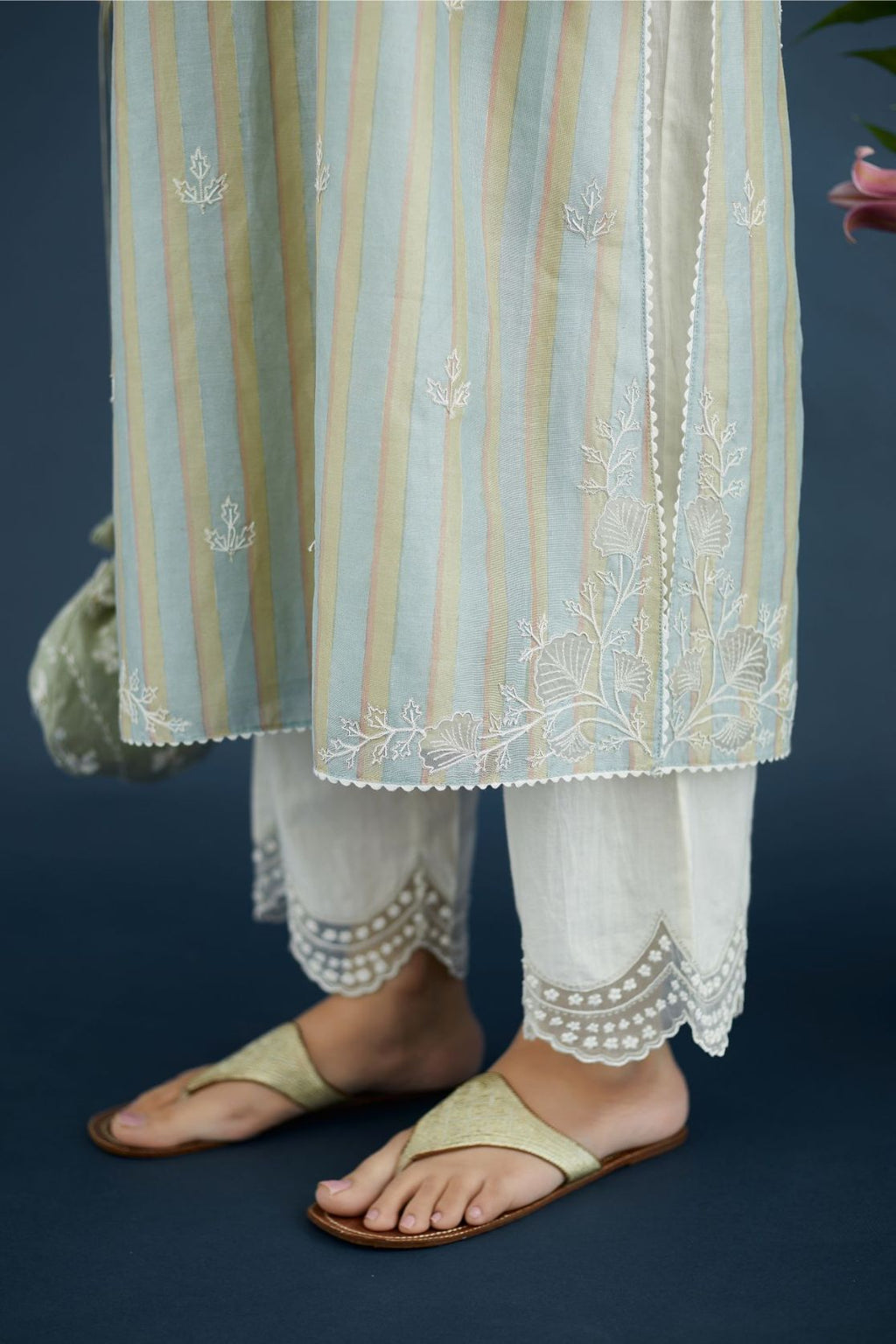 Multi striped hand block printed silk chanderi kurta set with cutwork flower embroidery and lace detailing at neck and side slits