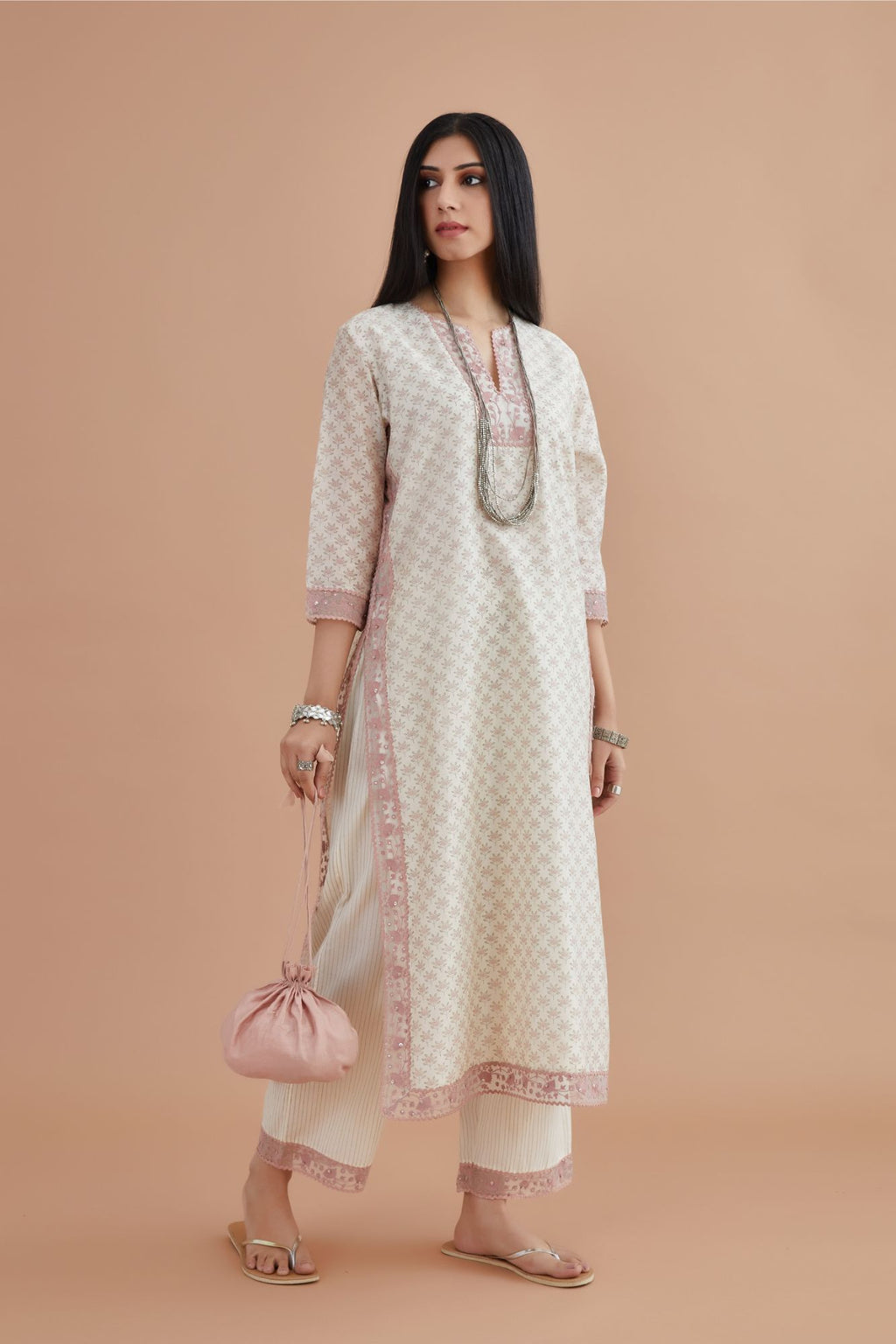 Silk Chanderi kurta set with all-over pink lotus hand block print and embroidery at neck, kurta sides and sleeves
