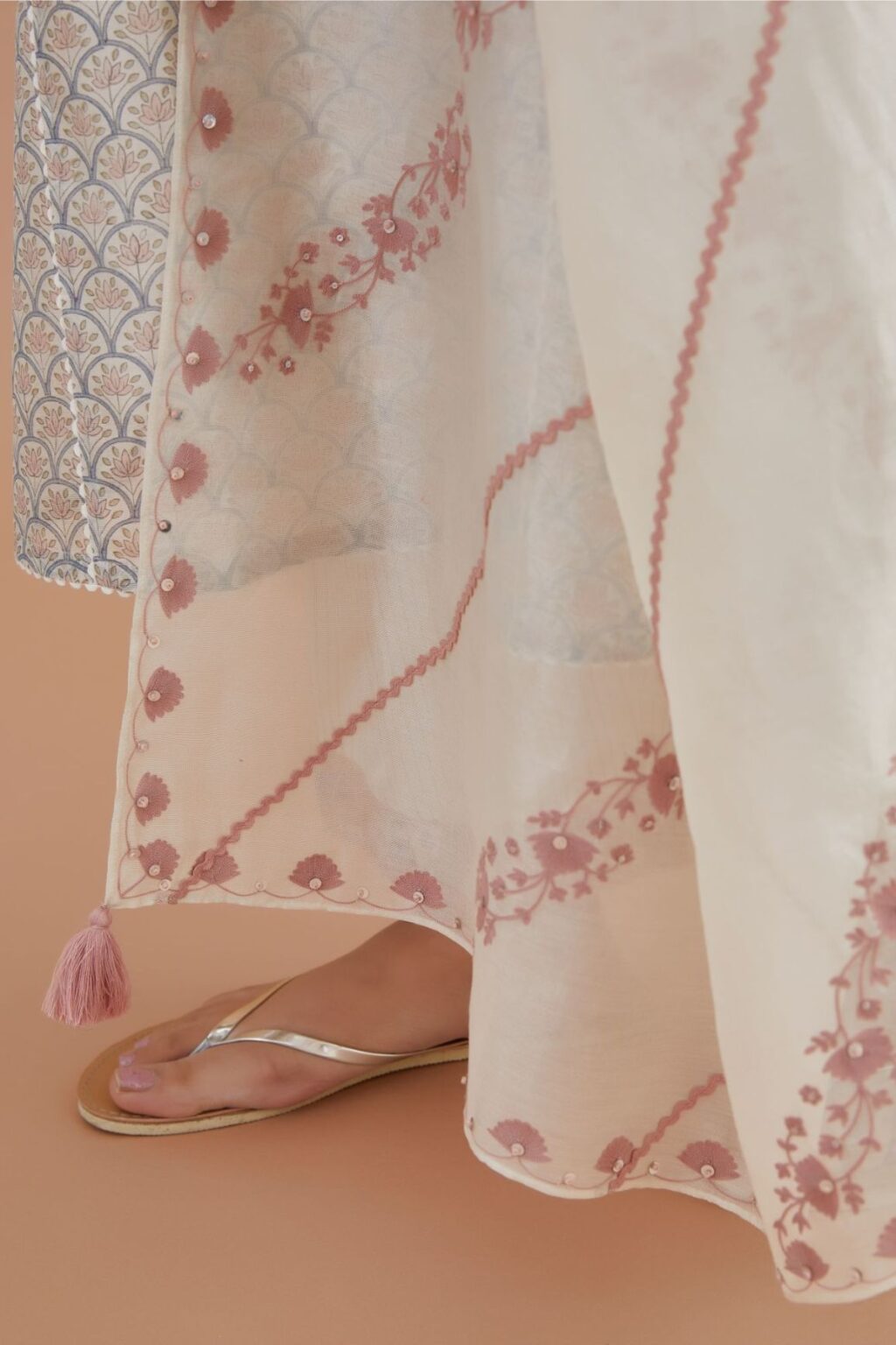 Off white silk Chanderi dupatta with all-over pink embroidery and rickrack, highlighted with sequin work.