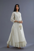 Off white silk chanderi kurta set with applique flower embroidery and lace detailing at neck and side slits