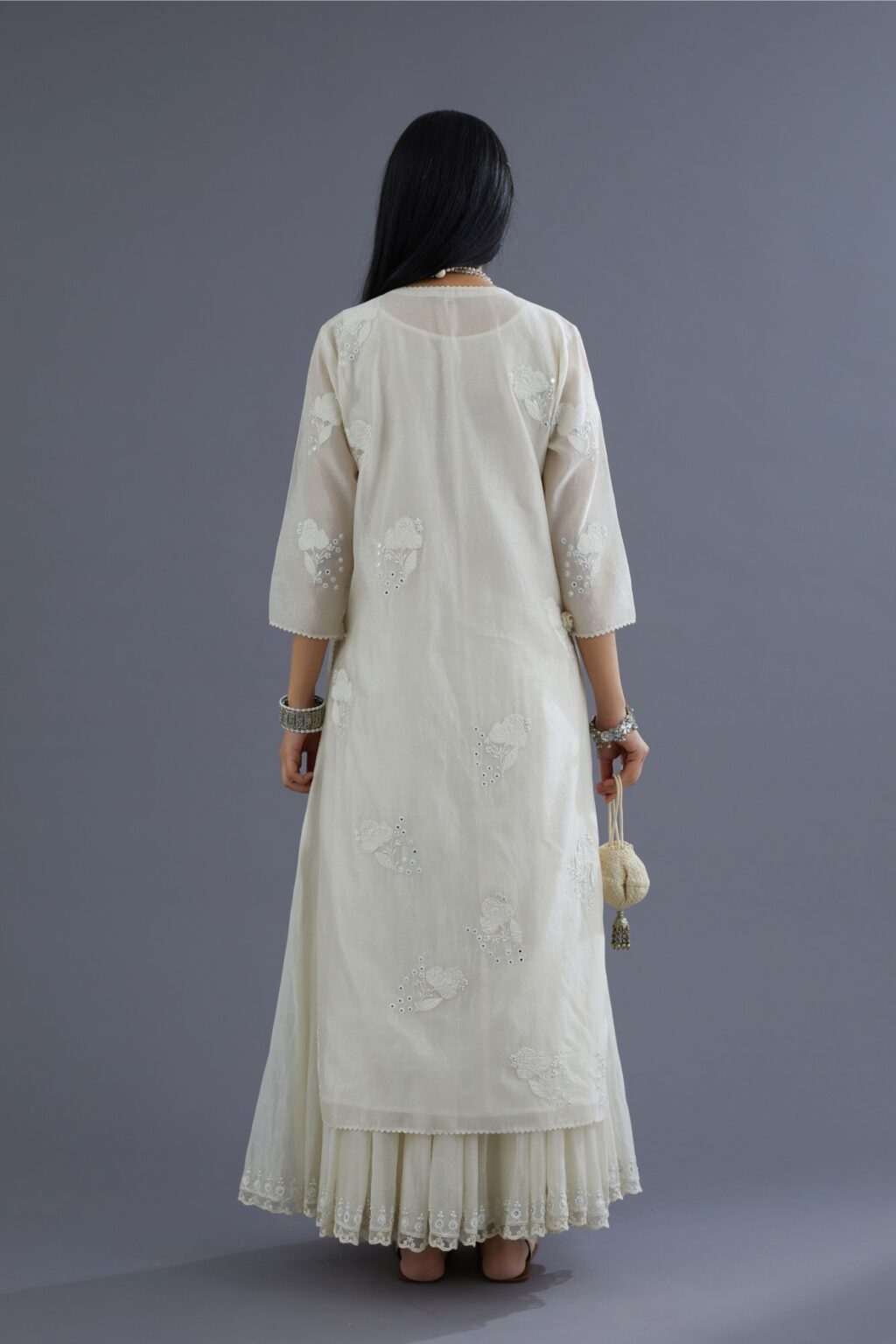 Off white silk chanderi kurta set with applique flower embroidery and lace detailing at neck and side slits
