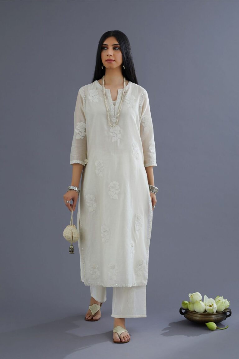 Off white silk chanderi kurta set with raised flower embroidery and mirror hand work
