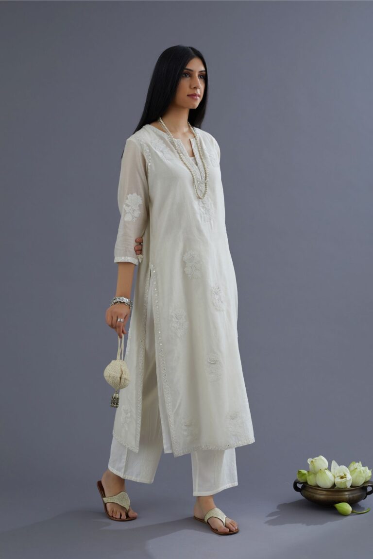 Off white silk chanderi kurta set with raised flower embroidery and mirror hand work