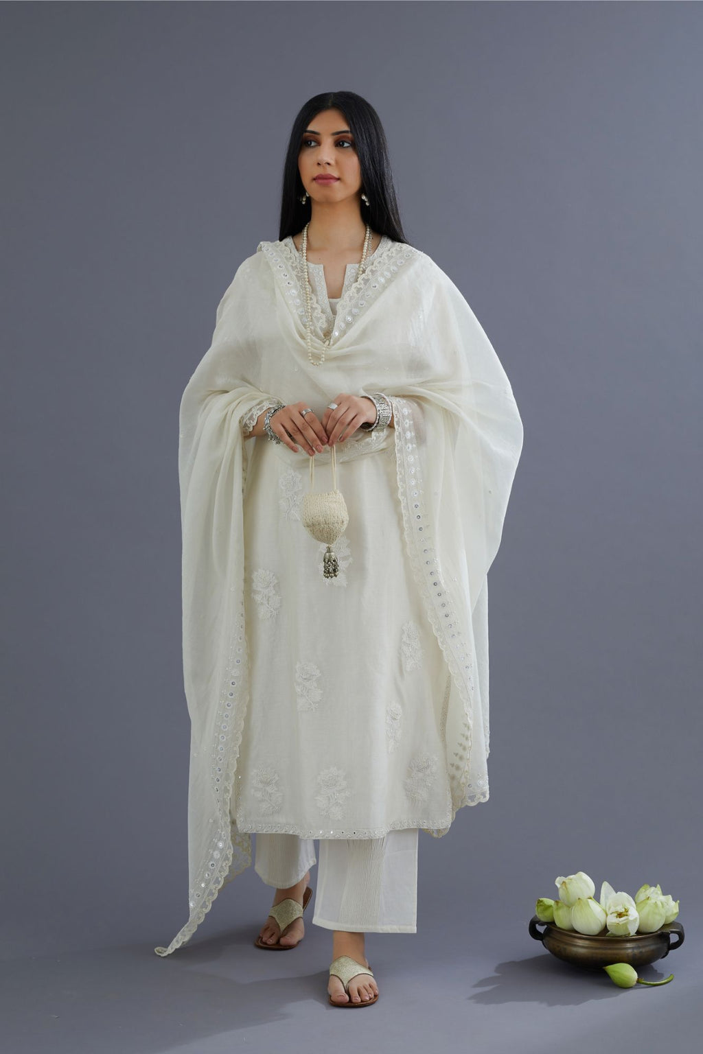 Off white silk chanderi kurta set with raised flower embroidery and mirror hand work