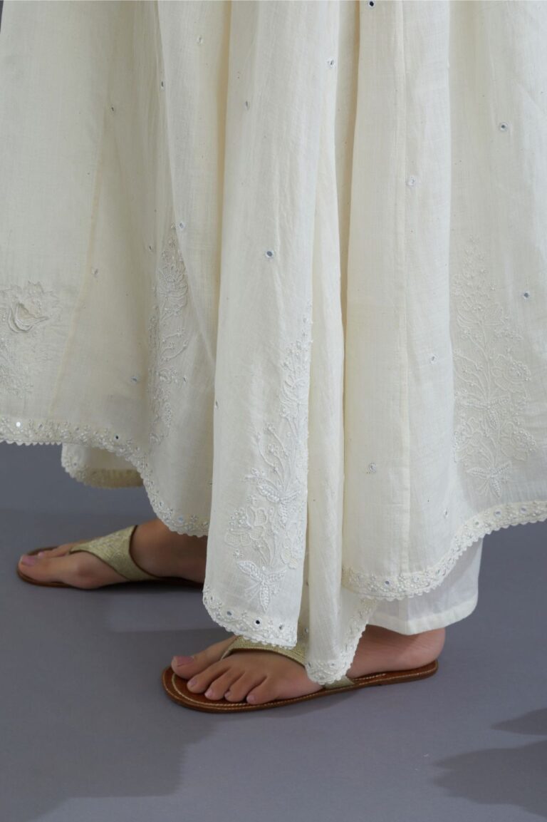 Off white Handspun Hand-Woven cotton kurta set with asymmetric hem, mirror hand work and raised flower embroidery