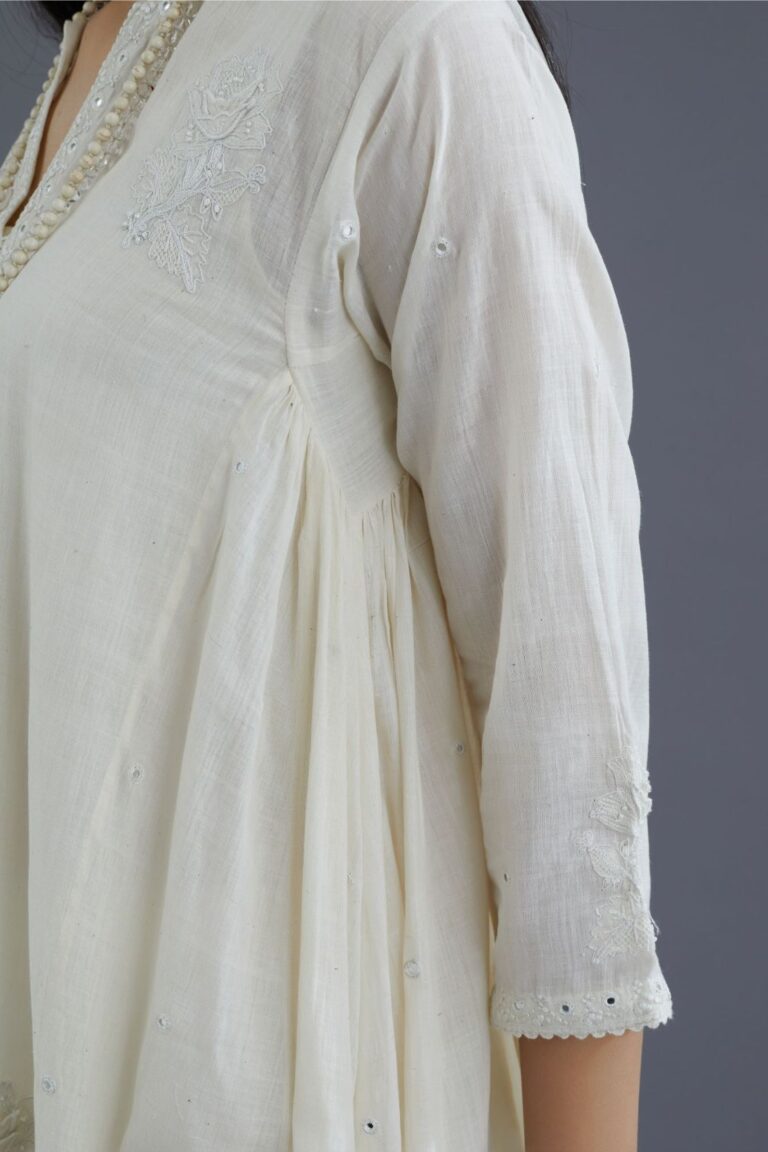 Off white Handspun Hand-Woven cotton kurta set with asymmetric hem, mirror hand work and raised flower embroidery