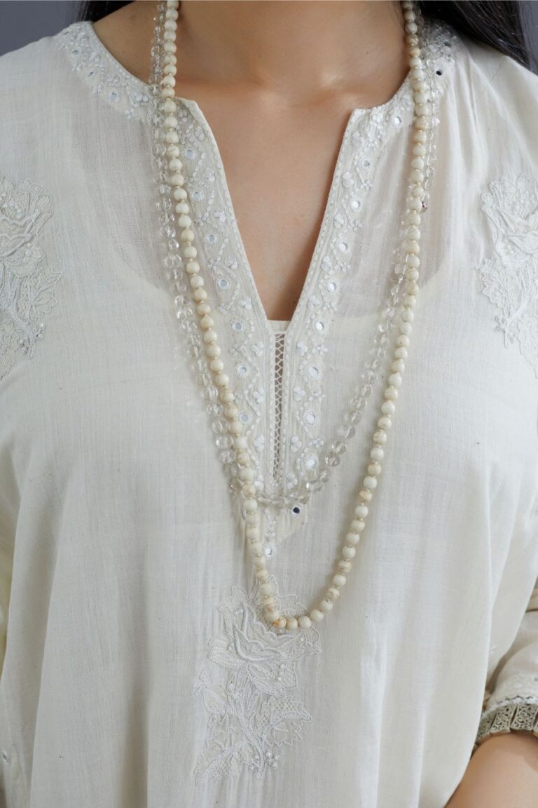 Off white Handspun Hand-Woven cotton kurta set with asymmetric hem, mirror hand work and raised flower embroidery