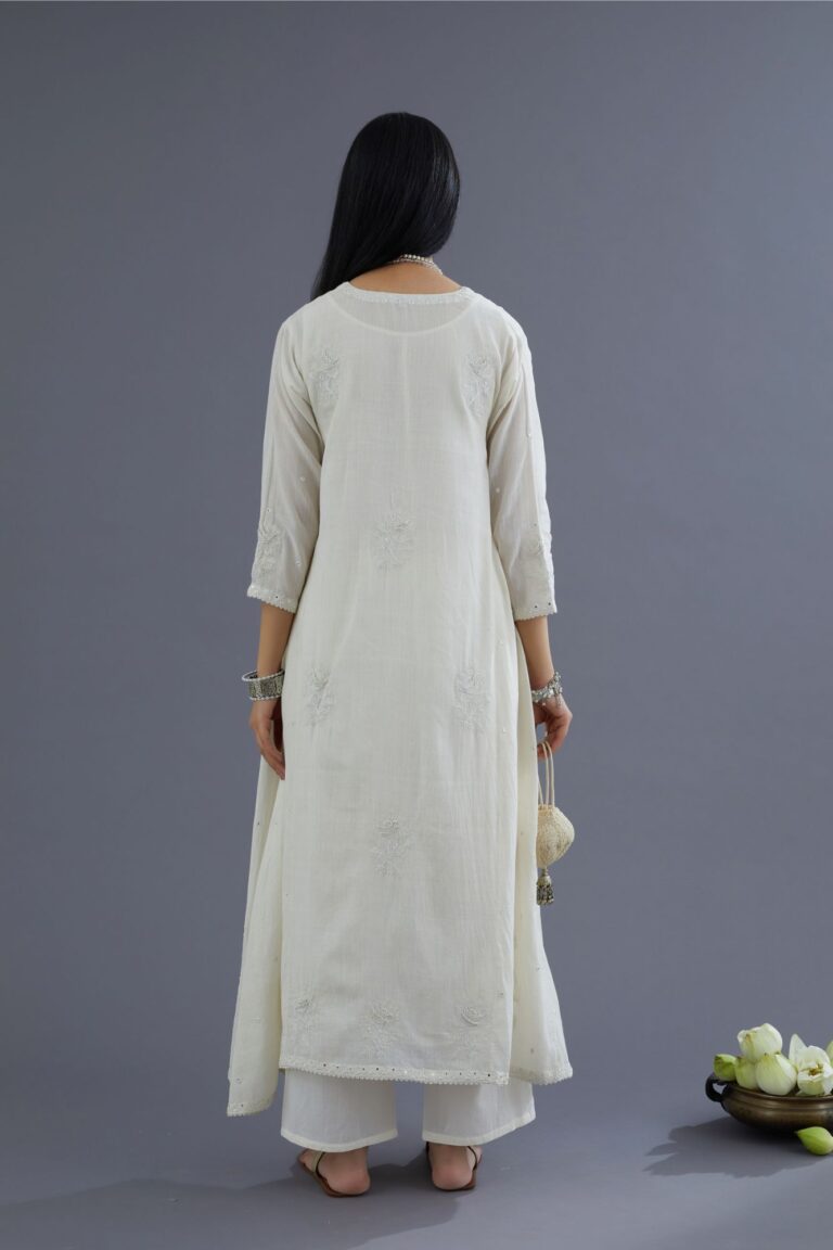 Off white Handspun Hand-Woven cotton kurta set with asymmetric hem, mirror hand work and raised flower embroidery