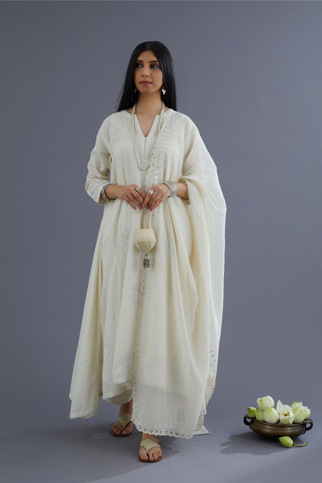 Off white Handspun Hand-Woven cotton kurta set with asymmetric hem, mirror hand work and raised flower embroidery