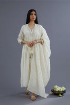 Handspun Hand-Woven cotton kurta set with wavy empire waistline and gathers, highlighted with applique flower embroidery and mirror hand work