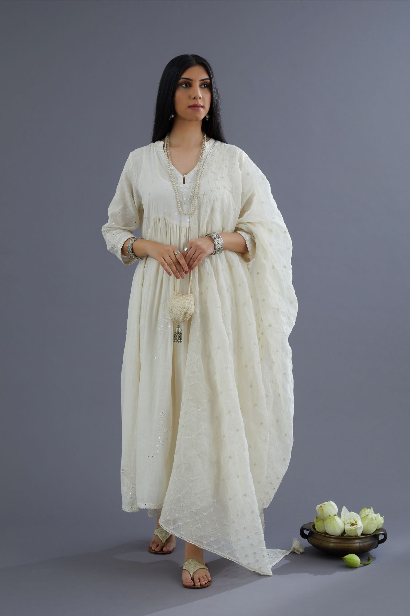 Handspun Hand-Woven cotton kurta set with wavy empire waistline and gathers, highlighted with applique flower embroidery and mirror hand work