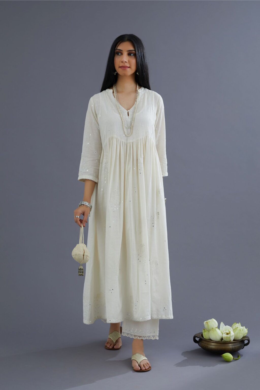 Handspun Hand-Woven cotton kurta set with wavy empire waistline and gathers, highlighted with applique flower embroidery and mirror hand work