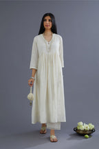 Handspun Hand-Woven cotton kurta set with wavy empire waistline and gathers, highlighted with applique flower embroidery and mirror hand work
