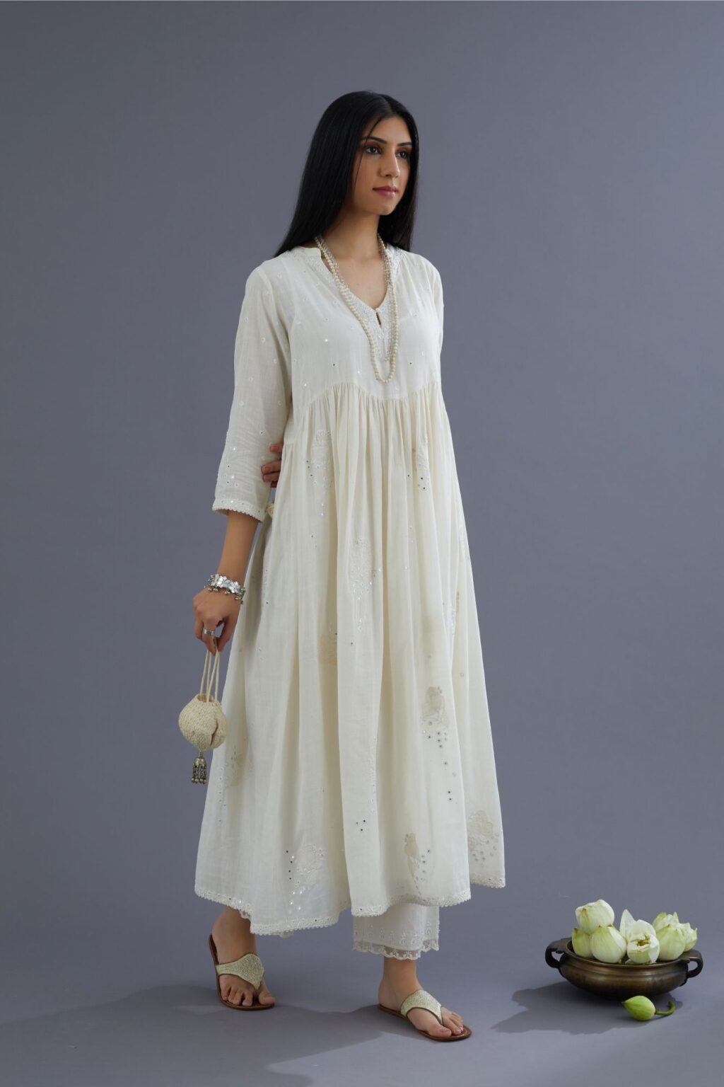 Handspun Hand-Woven cotton kurta set with wavy empire waistline and gathers, highlighted with applique flower embroidery and mirror hand work