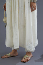 Handspun Hand-Woven cotton kurta set with wavy empire waistline and gathers, highlighted with applique flower embroidery and mirror hand work