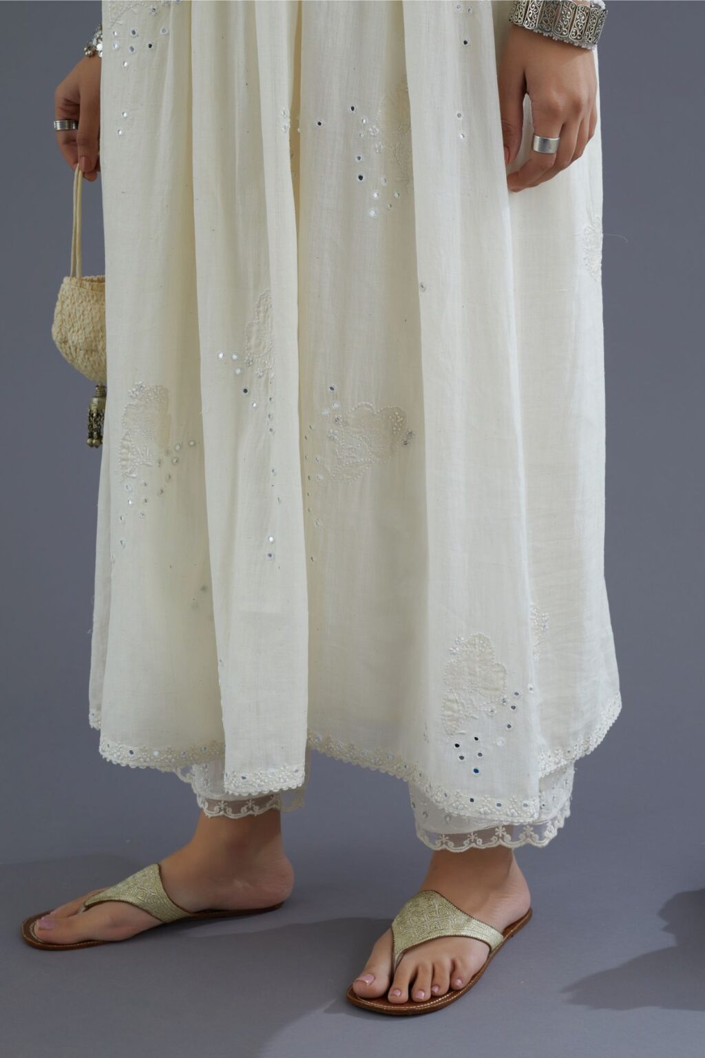 Handspun Hand-Woven cotton kurta set with wavy empire waistline and gathers, highlighted with applique flower embroidery and mirror hand work