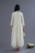 Handspun Hand-Woven cotton kurta set with wavy empire waistline and gathers, highlighted with applique flower embroidery and mirror hand work