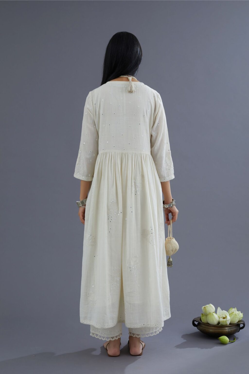 Handspun Hand-Woven cotton kurta set with wavy empire waistline and gathers, highlighted with applique flower embroidery and mirror hand work