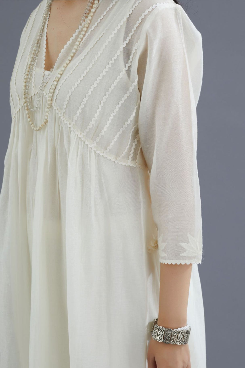 Off white cotton chanderi kurta set with gathered empire waist line in front and back and cotton slip