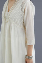 Off white cotton chanderi kurta set with gathered empire waist line in front and back and cotton slip