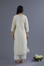 Off white chanderi kurta set with all-over applique flower embroidery and lace detailing at neck and side slits