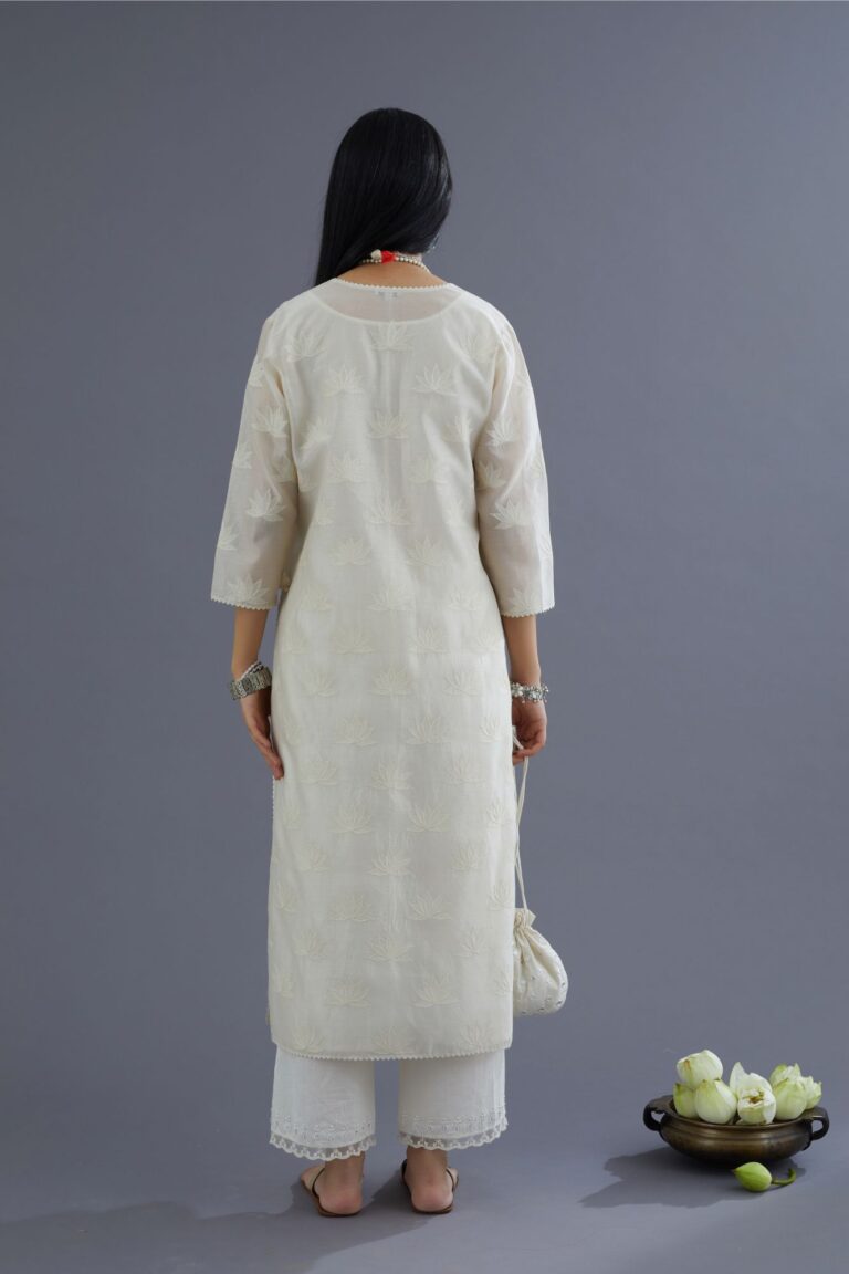 Off white chanderi kurta set with all-over applique flower embroidery and lace detailing at neck and side slits