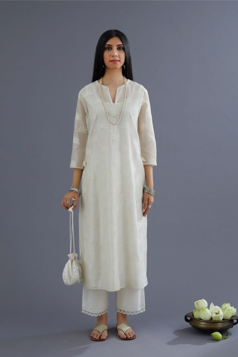 Off white chanderi kurta set with all-over applique flower embroidery and lace detailing at neck and side slits