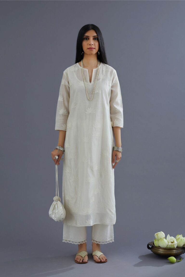 Off white silk chanderi kurta set with all-over applique lotus flower embroidery and lace detailing at neck and side slits