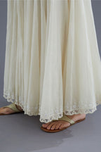 Off white cotton Chanderi multi paneled skirt with lace, embroidery and sequin hand work detailing at edges