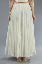 Off white cotton Chanderi multi paneled skirt with lace, embroidery and sequin hand work detailing at edges