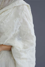 Cotton Chanderi dupatta with all over knotted thread embroidery and fabric tassels at all corners.