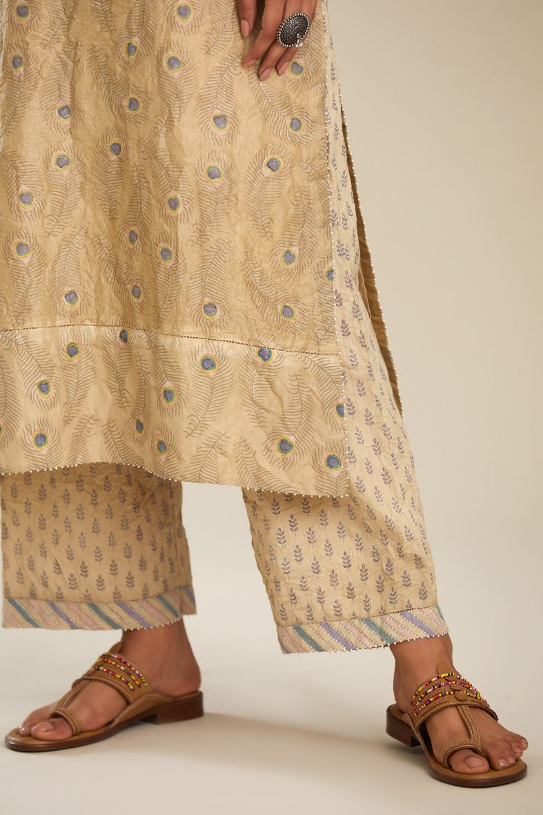 Beige hand block printed straight kurta set with silk yoke detailing in front.