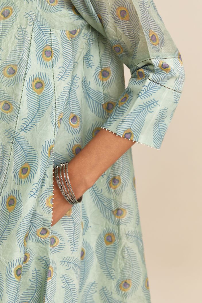 Hand block printed short kalidar kurta set in silk chanderi, highlighted with faggoting at side panels.
