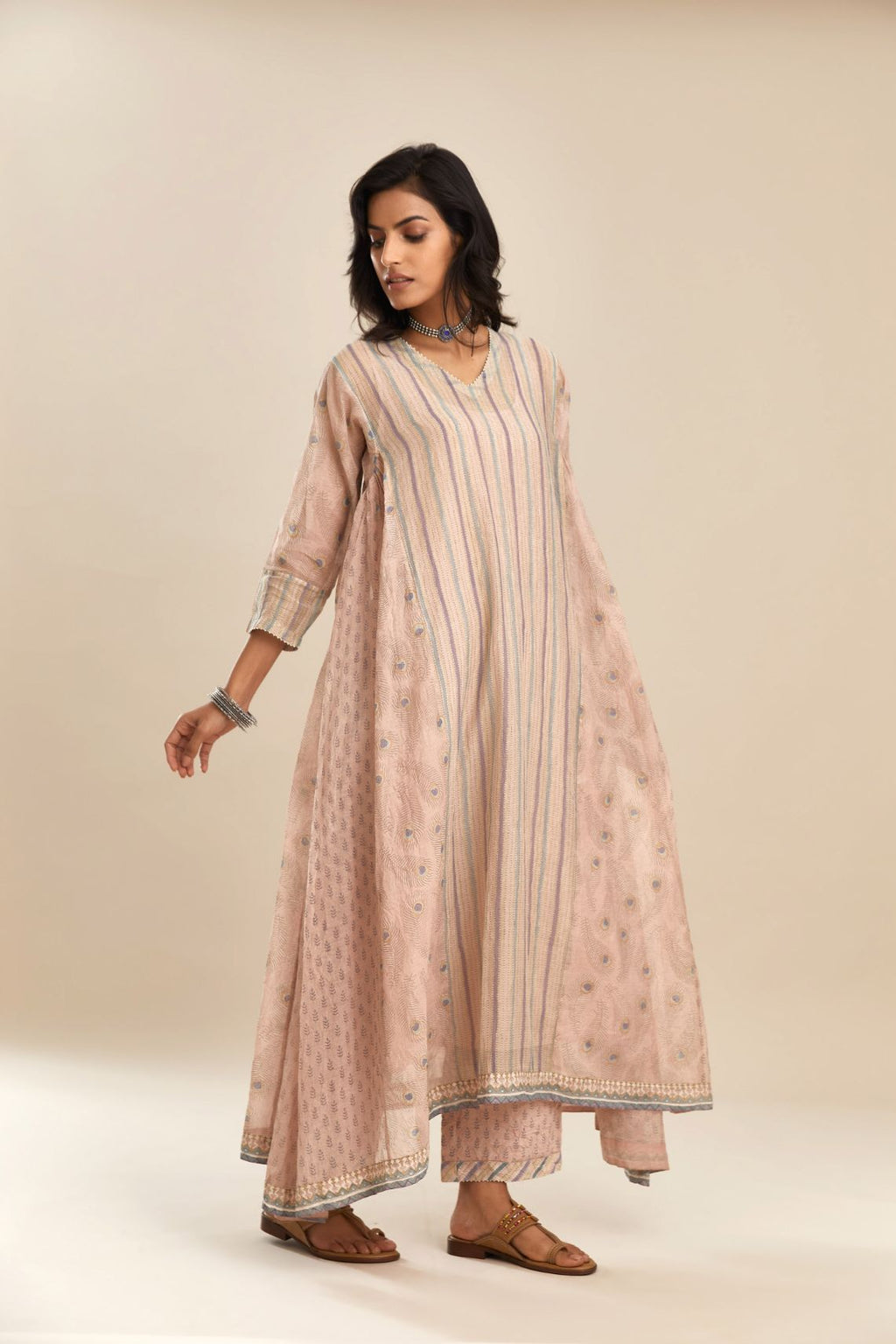 Pink hand block printed cotton Chanderi kurta set with asymmetric hem, highlighted with off white bead hand work detail at neck  and sleeves.