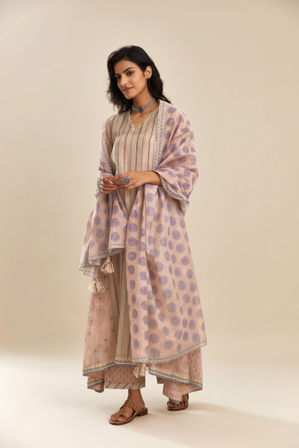 Pink hand block printed cotton Chanderi kurta set with asymmetric hem, highlighted with off white bead hand work detail at neck  and sleeves.