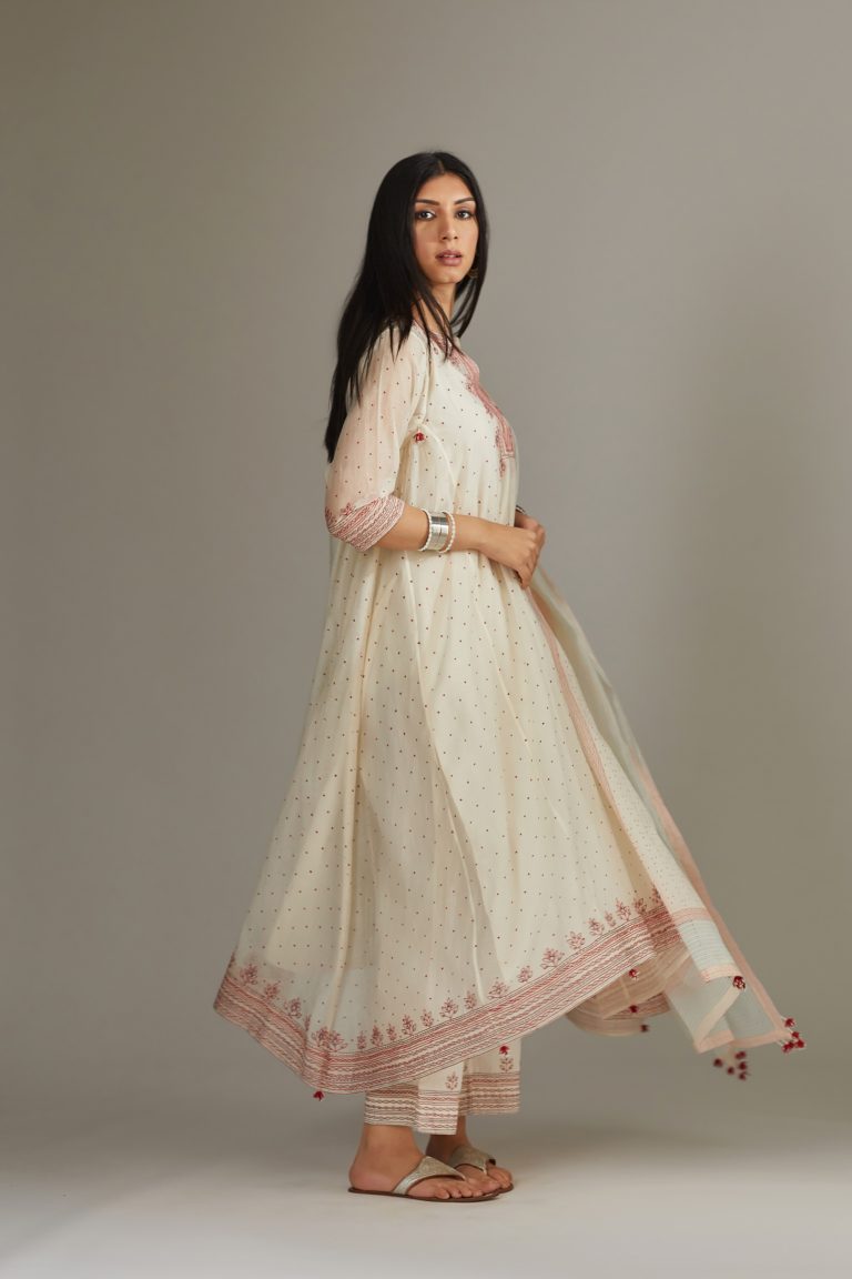 Asymmetric hand block printed kurta set with contrast quilted embroidery